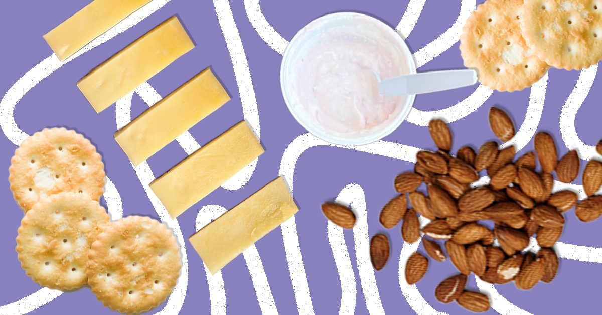 Healthy lunch and snack ideas, protein bars, healthy popcorn, cheese, crackers, almonds, and yogurt. 