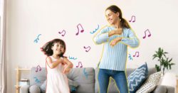 A mother and daughter dancing in the living room