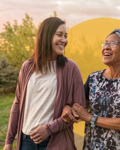 an older woman holding onto a younger woman