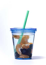 Orange slices and blueberries in blue plastic insulated cup